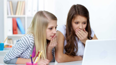two-adolescent-girls-finding-information -online-about-sexual-health-and-relationships